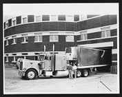 Delivery truck docked outside of Joyner Library